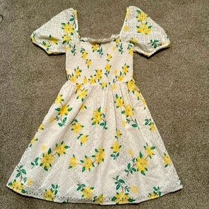 White eyelet dress from Parker James, delicate yellow flowers